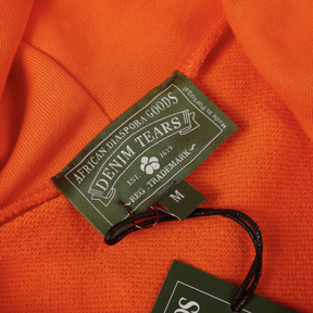 Denim Tears Oranger Freizeit-Trainingsanzug: Stylisch, Bequem, Modern für Alltag und Sport