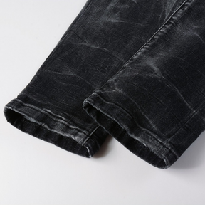 Amiri Luxus Herren Slim Fit Jeans mit auffälligen blauen Patches