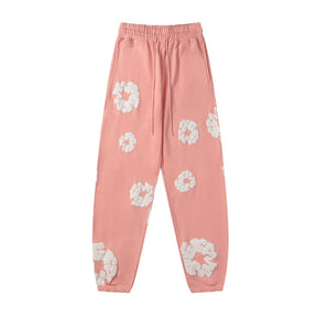 Denim Tears Rosa Baumwoll-Trainingsanzug: Stilvoller Freizeit-Look für Damen und Herren