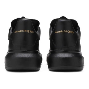 Alexander McQueen Schwarzer Leder Sneaker: Luxus, Komfort & Ikonischer Stil