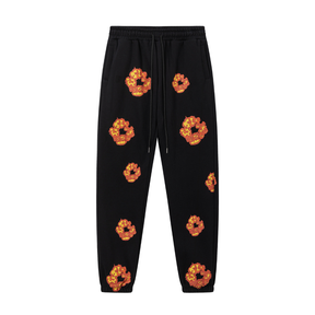 Denim Tears Schwarz Orange Trainingsanzug: Stylisch, Bequem, Exklusiv für Streetwear-Fans