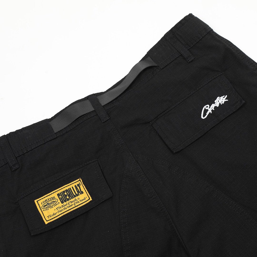 Corteiz Cargo Shorts Schwarz Gelb – Robuste Streetwear für den urbanen Look